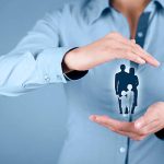 insurance (46) Family life insurance, family services, family policy and supporting families concepts. Woman with protective gesture and silhouette representing young family.